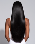 MOFRA Ébène clip-in hair extensions, back view, deep jet black silk press hair, light grey studio background