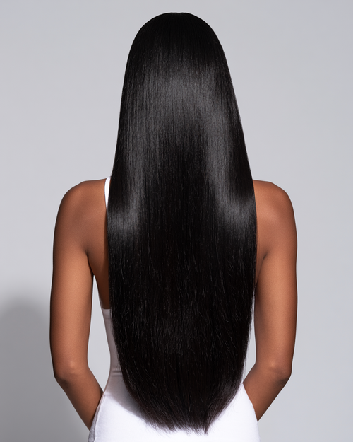 MOFRA Ébène clip-in hair extensions, back view, deep jet black silk press hair, light grey studio background